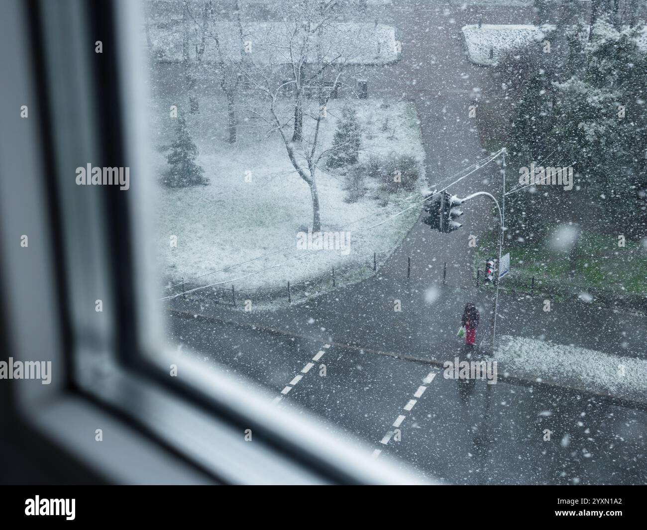 View from the window over heavy fluffy snow falling over a lonely ...