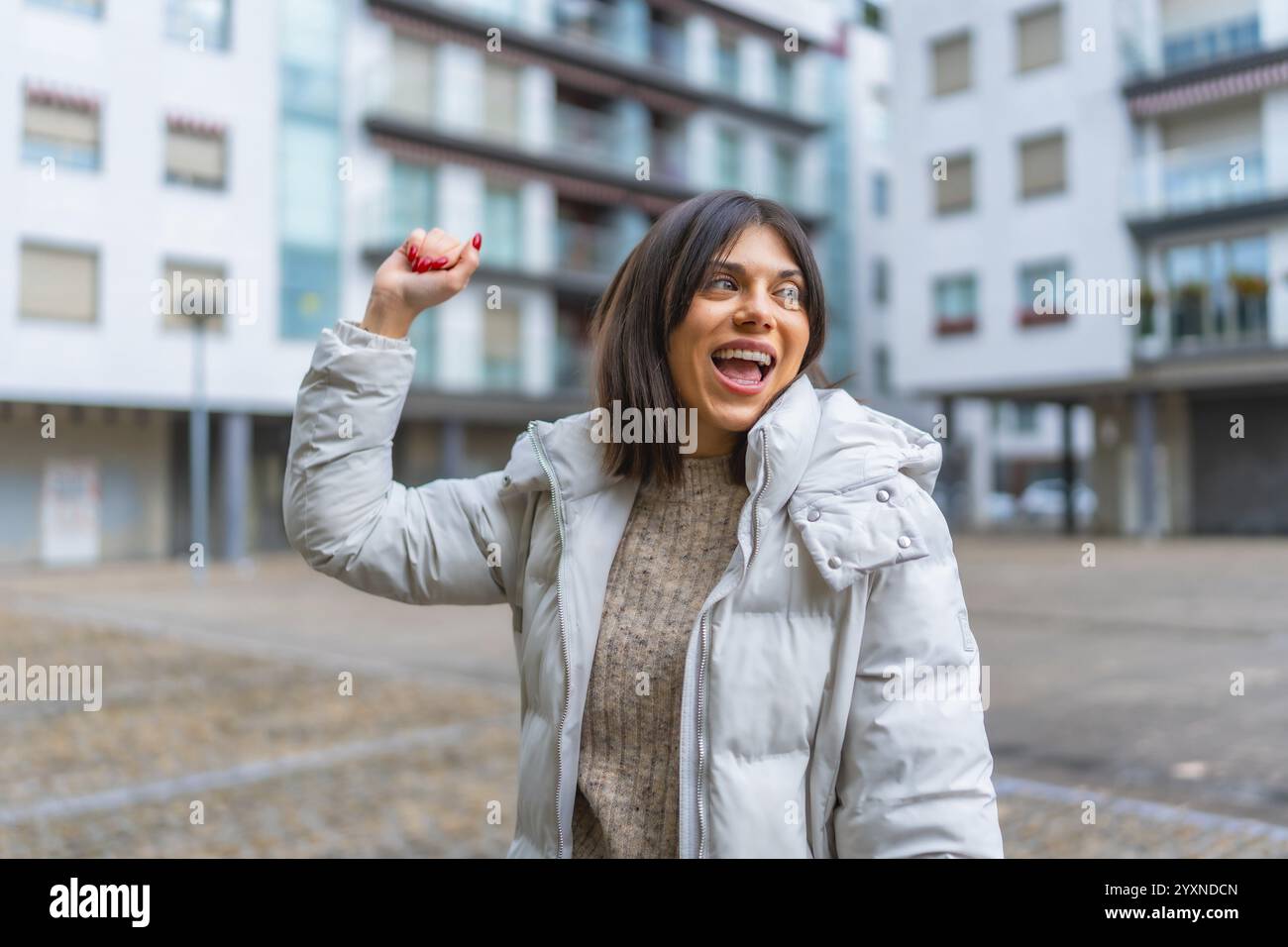 Woman dancing happily in city hi-res stock photography and images - Alamy