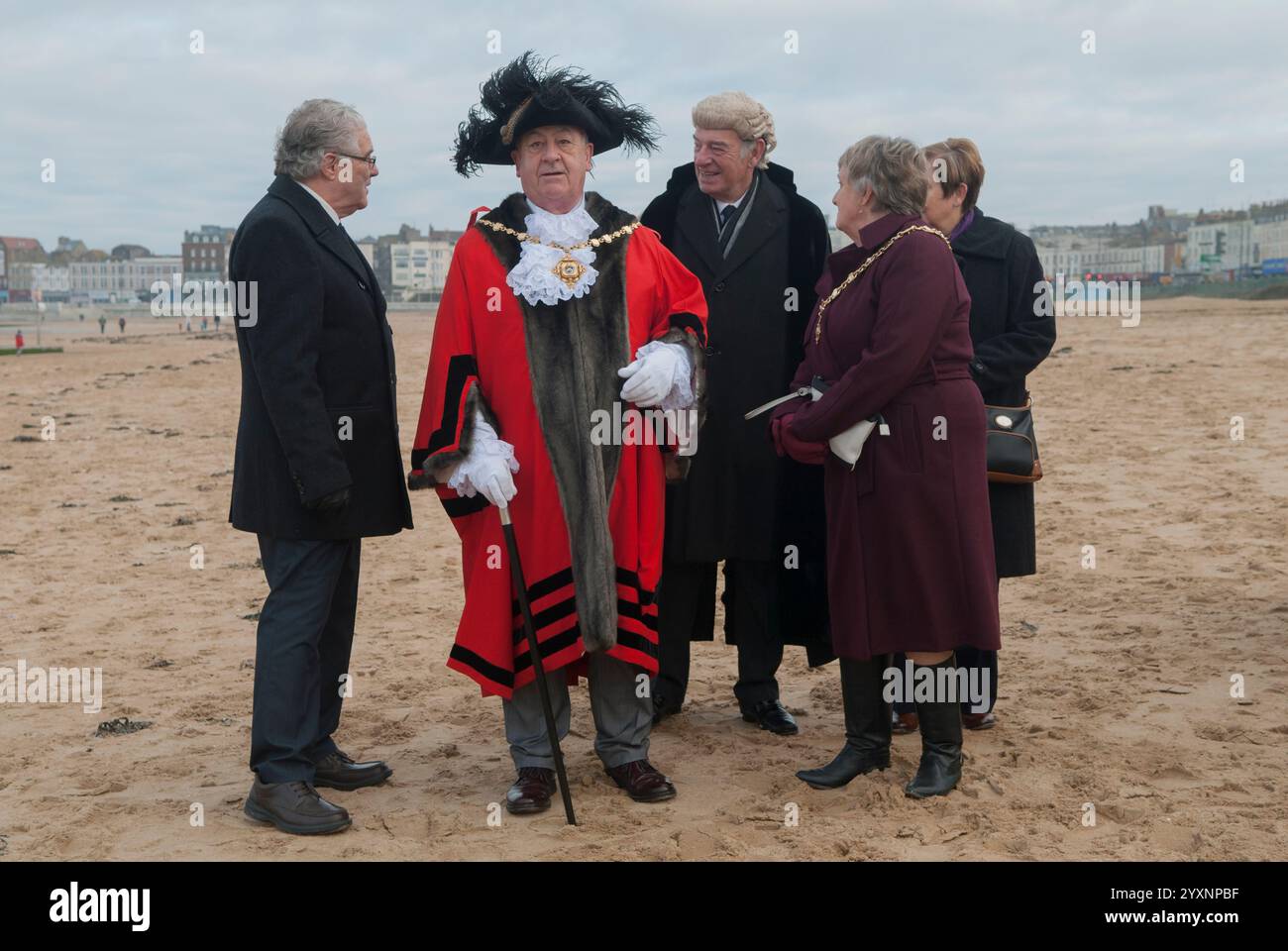 Mayor of Margate Cllr Robin Edwards, his wife the Lady Mayoress  and officials after  the Blessing the Sea ceremony along with a bewigged colleague. Margate beach after the Epiphany - 6th January annual ceremony marking the baptism of Christ. Margate, Kent, England 8th January 2017. 2010s UK HOMER SYKES Stock Photo