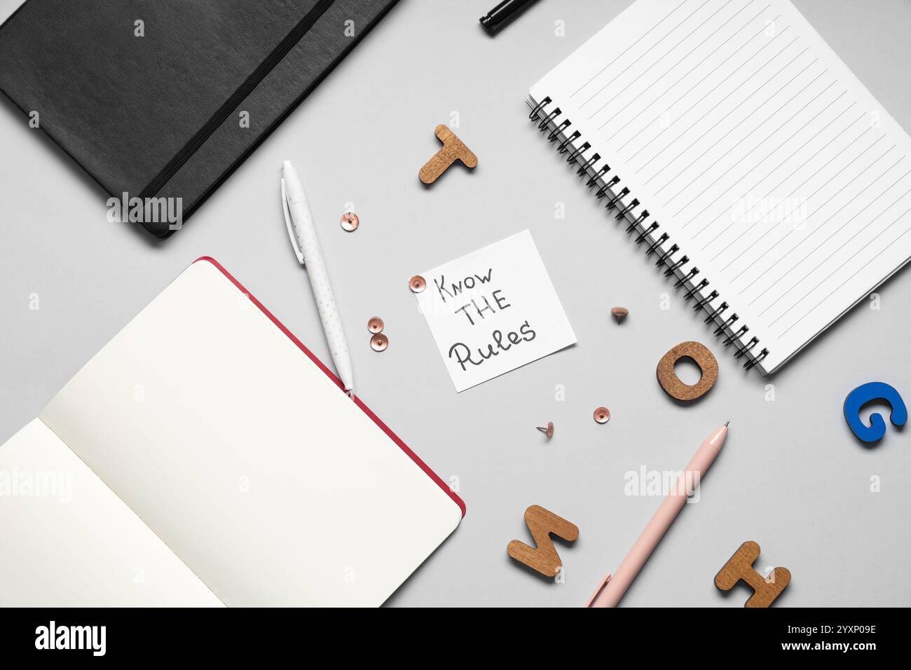 Paper with text KNOW THE RULES and stationery on light background Stock ...
