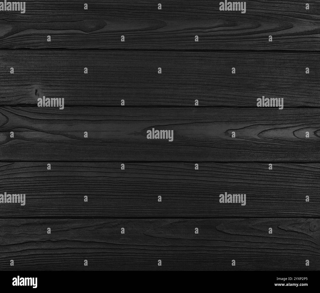 Black painted wooden planks displaying intricate wood grain patterns ...