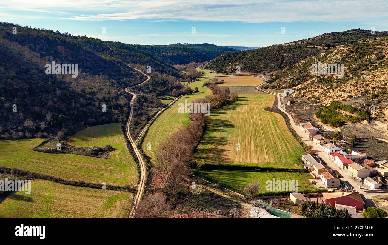 U-shaped valley with a river running in the background. Stock Photo