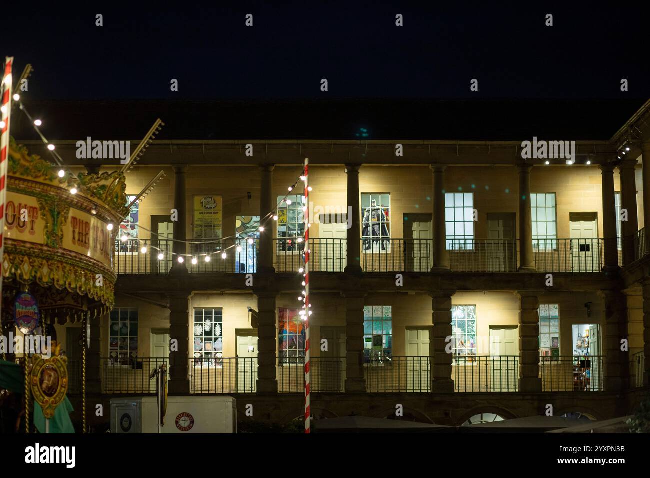 Christmas lights and views of the iconic Piece Hall, Halifax, West Yorkshire, UK. The Piece Hall is a Grade I listed building in Halifax, West Yorkshire, England. It was built as a cloth hall for handloom weavers to sell the woollen cloth 'pieces' they had produced. It has over recent years become popular as a venue for music. Stock Photo