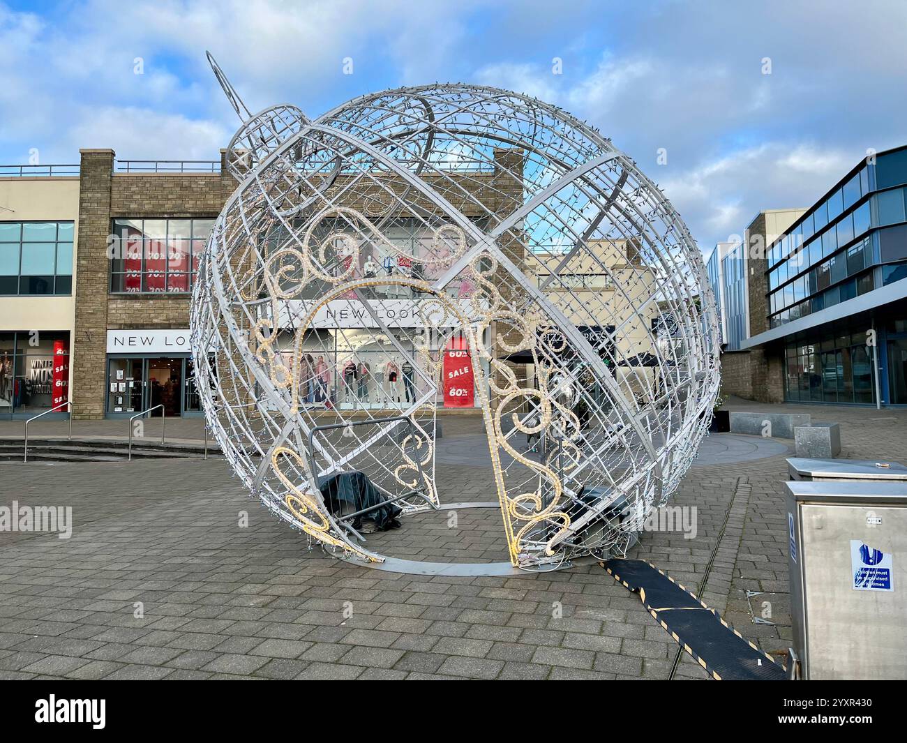 A Giant Christmas Bauble decoration on Saint Catherine's Walk. Carmarthen, Wales, United Kingdom. 11th December 2024. - Smartphone Captured Stock Image