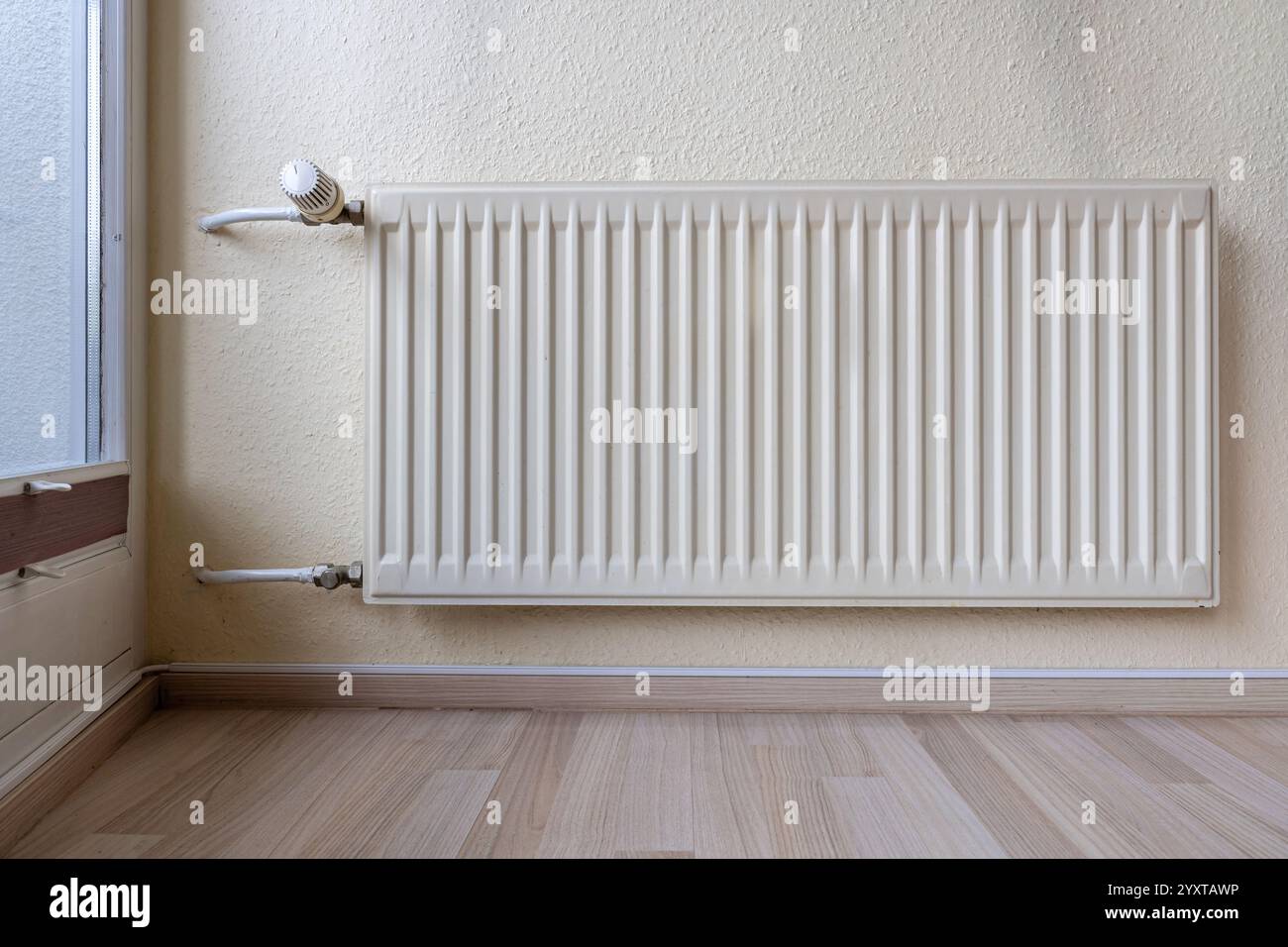 wall mounted radiator in private household Stock Photo - Alamy