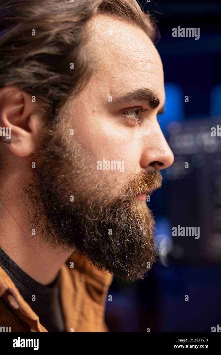 Focus on developer typing code on computer in blurry background to ...