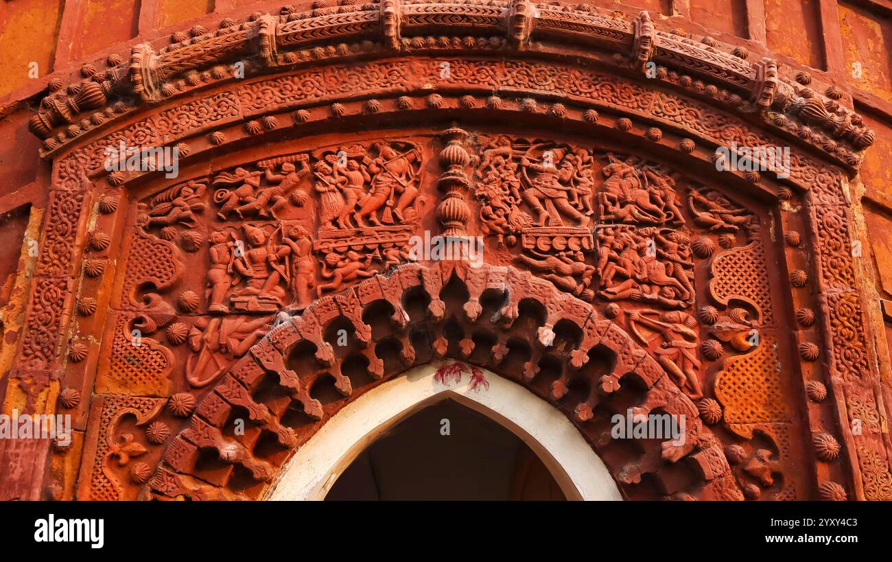 Terracotta facade Shiva Temple 1 from left, depicting Lakshman fighting against Ravana’s son Indrajit (Meghnad), Uchkaran, Birbhum, West Bengal, India Stock Photo