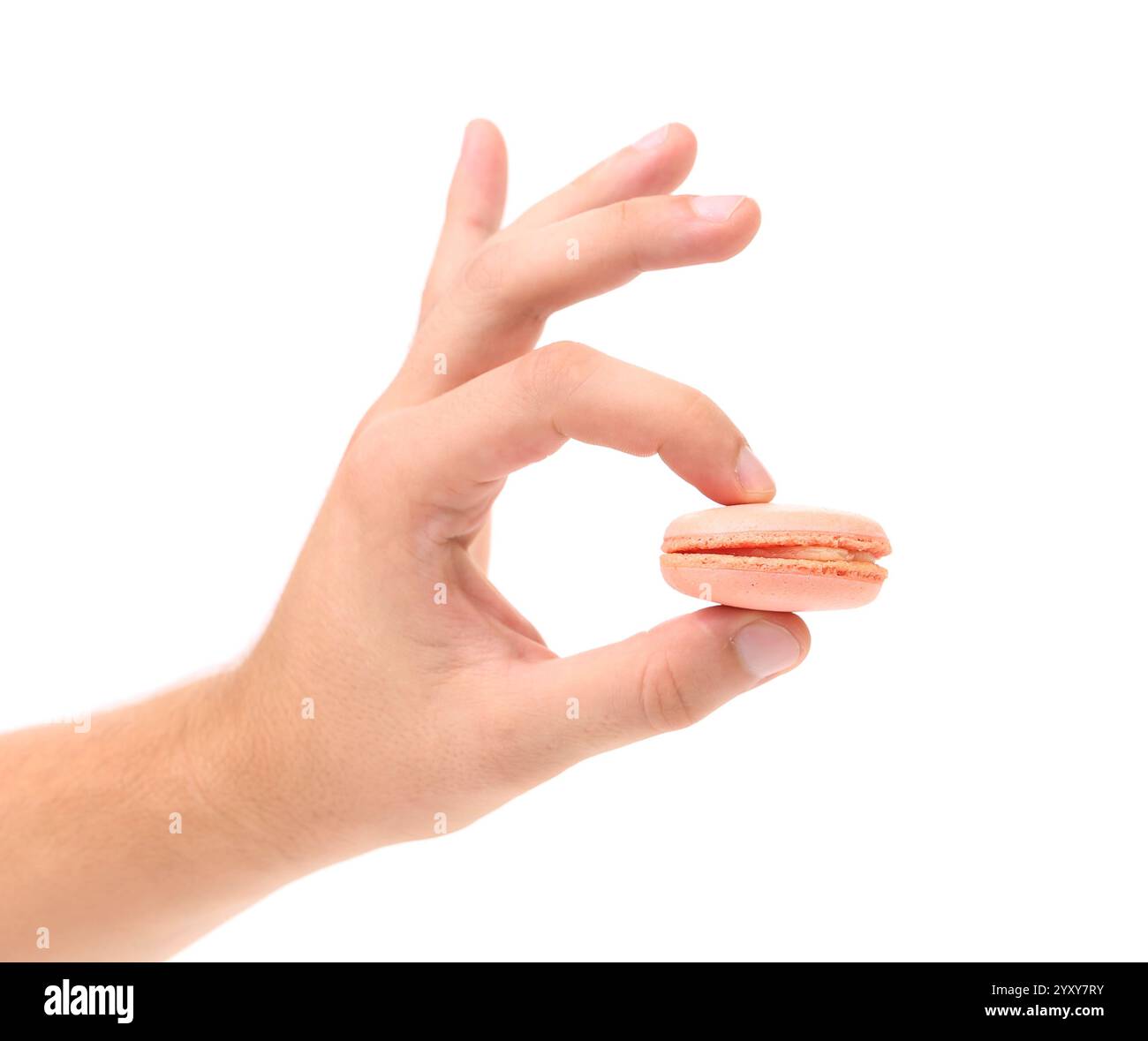 Hand holds macaron. Close up, white background Stock Photo - Alamy