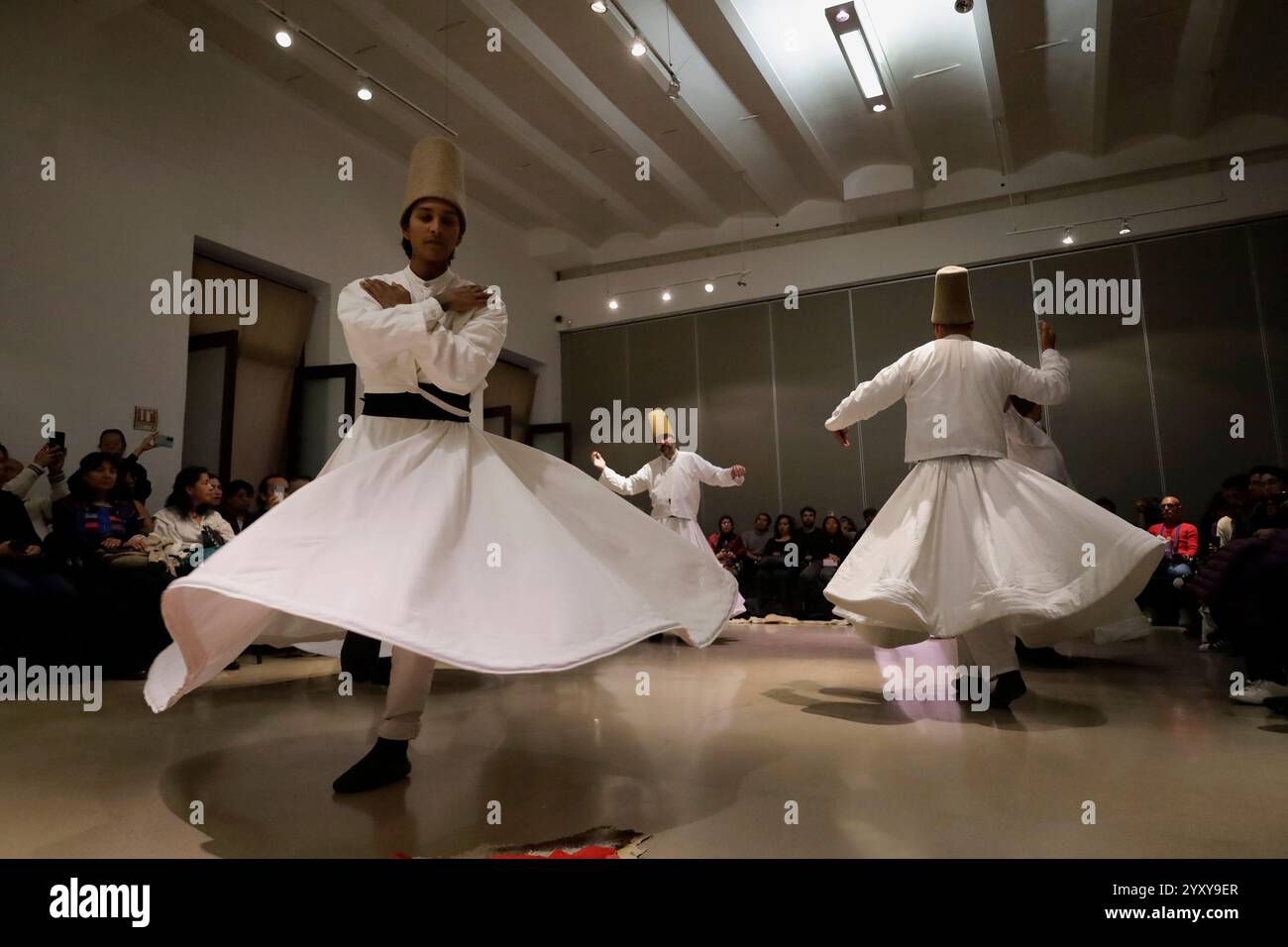 Mexico City, Mexico. 17th Dec, 2024. Members of the Nur Ashki Jerrahi and Tekke Sufi Community in Mexico City, Mexico, on December 17, 2024, pay tribute through a Sufi dance to the Persian poet Jalal ad-Din Muhammad Rumi. Among the main themes of his teachings and poetry, the unity between body and spirit stands out. (Photo by Gerardo Vieyra/NurPhoto) Credit: NurPhoto SRL/Alamy Live News Stock Photo