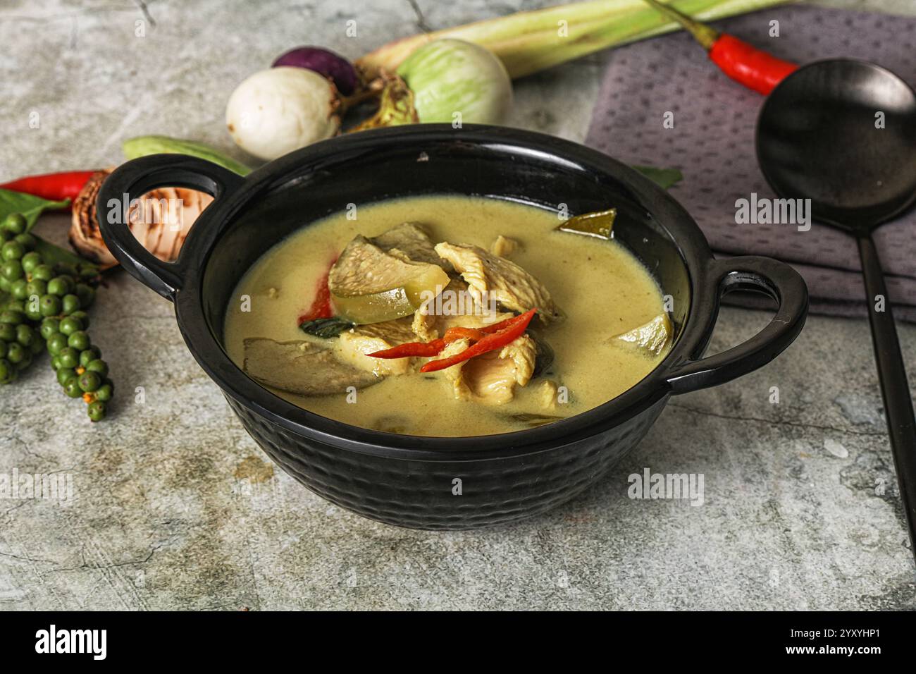 Thai green chicken curry with coconut milk and basil Stock Photo - Alamy