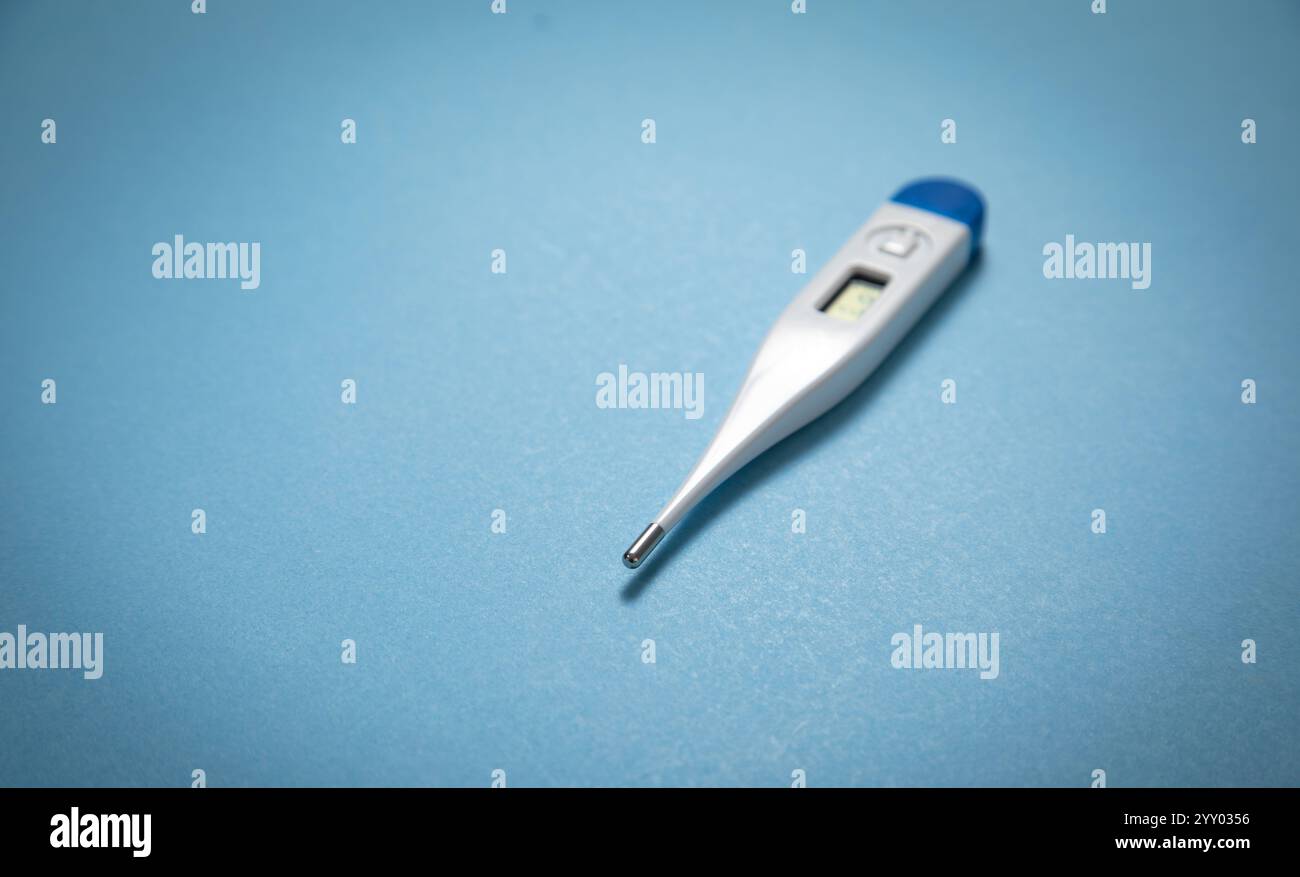 Digital thermometer on blue background hi-res stock photography and ...