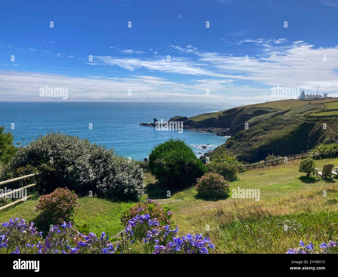 Looking south from Housel Bay to the Lizard Point with the lighthouse in the distance - John Gollop - Smartphone Captured Stock Image