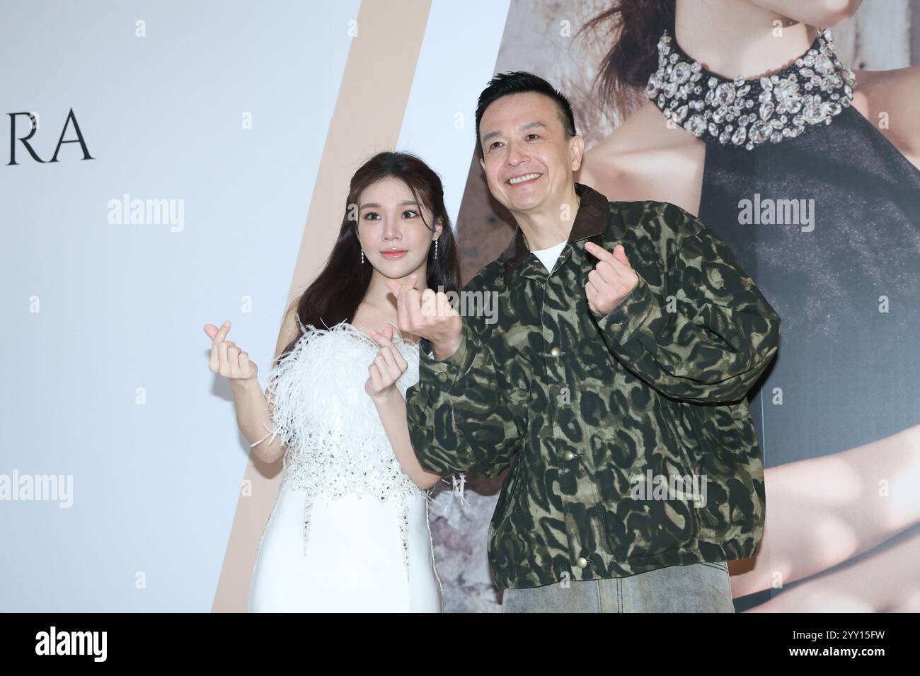 Taipei. 18th Dec, 2024. Dolly, a member of the girl group G.O.F., and Taiwanese singer Jason attend the opening ceremony of the dress brand in Taipei, Taiwan, on December 18, 2024. (Photo by Costfoto/NurPhoto) Credit: NurPhoto SRL/Alamy Live News Stock Photo