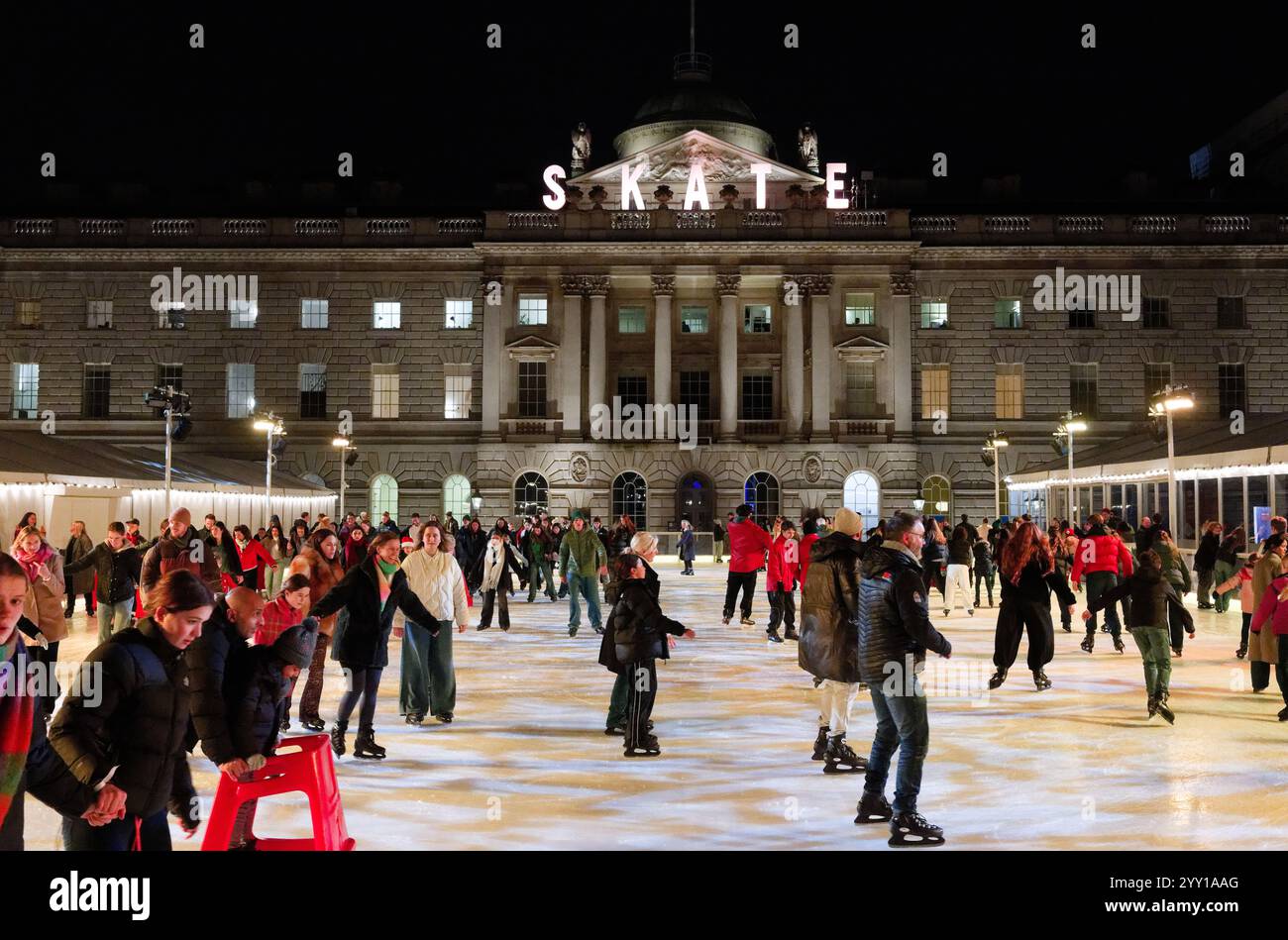 Skating on the ice rink at somerset house hi-res stock photography and ...