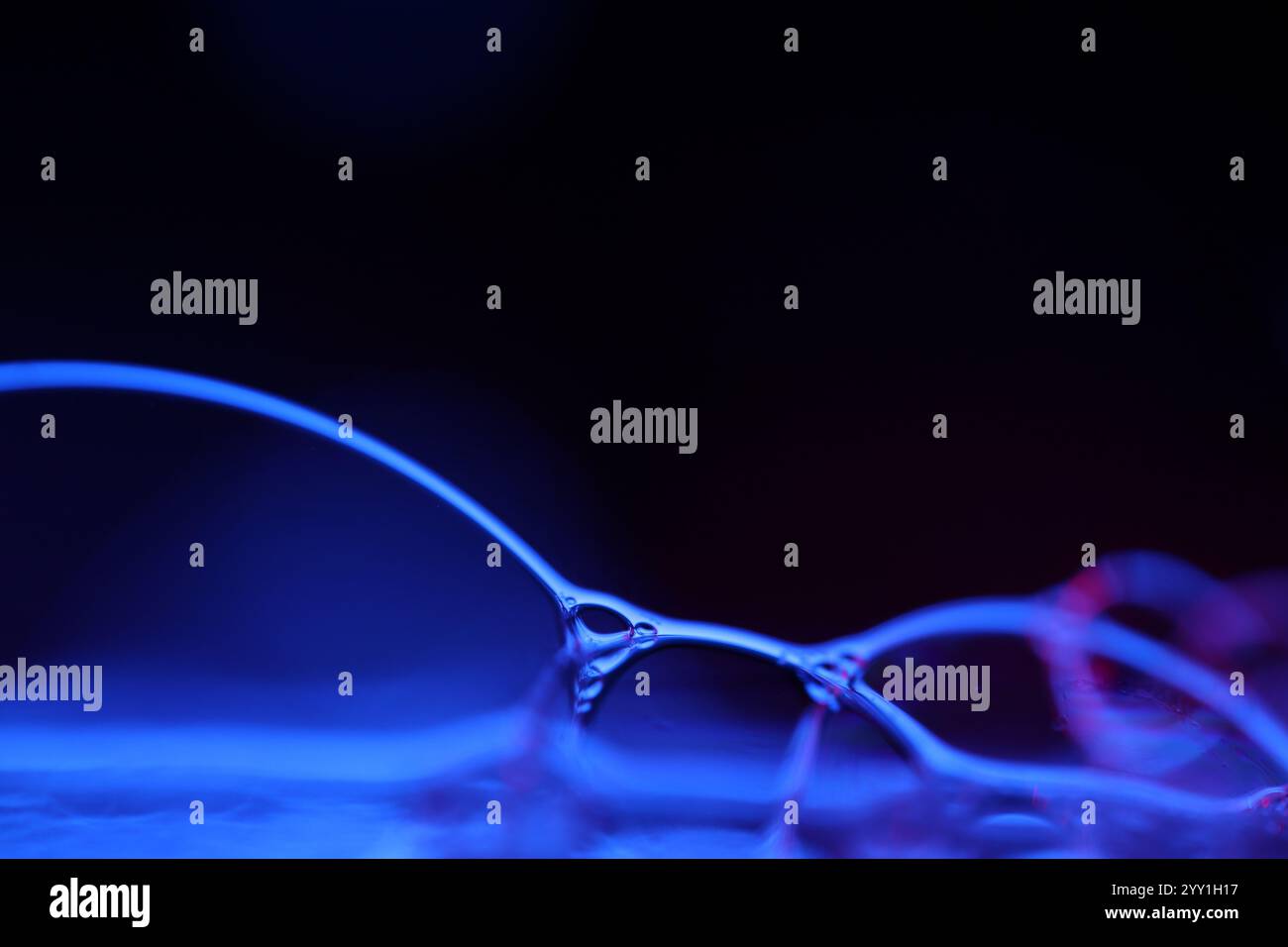 Blue fantastic reflections on black background, liquid abstraction, colour waves, deep dark backgrounds Stock Photo