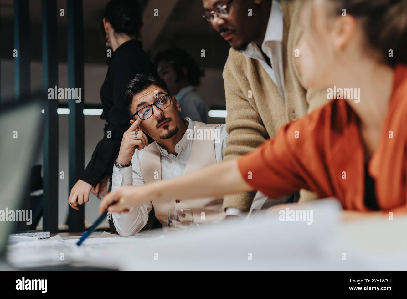 Diverse team brainstorming innovative business ideas in office setting ...