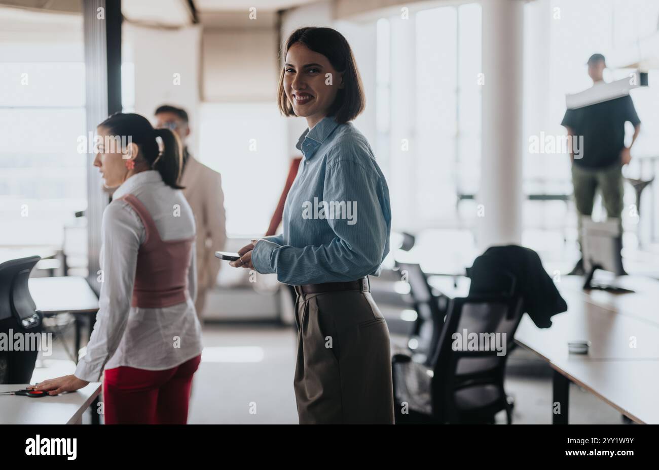 Multicultural team engaging in a collaborative office meeting Stock Photo