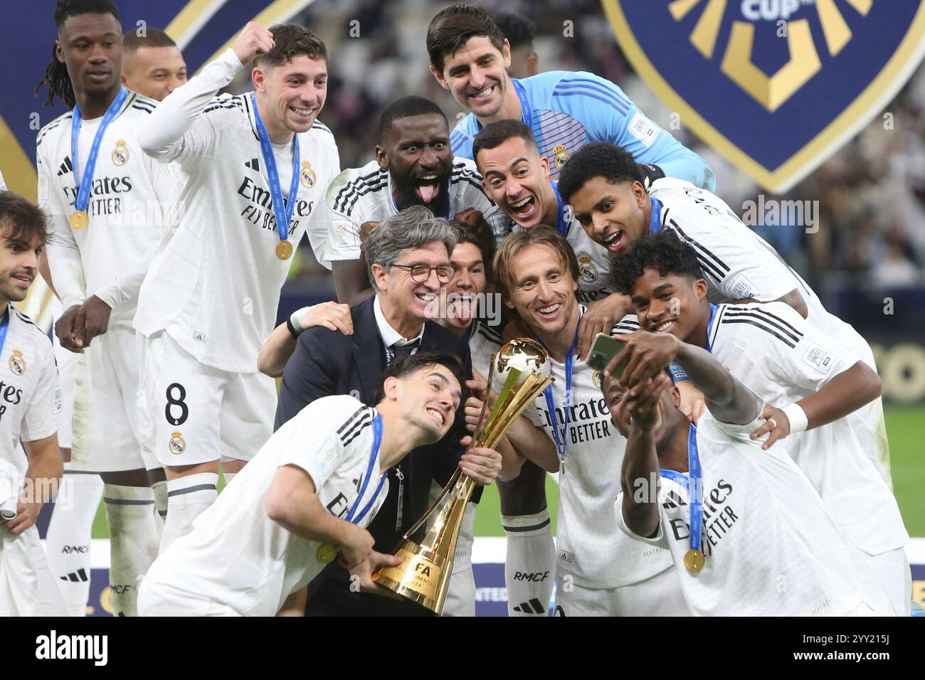 Real Madrid's players celebrate with the trophy after winning the ...