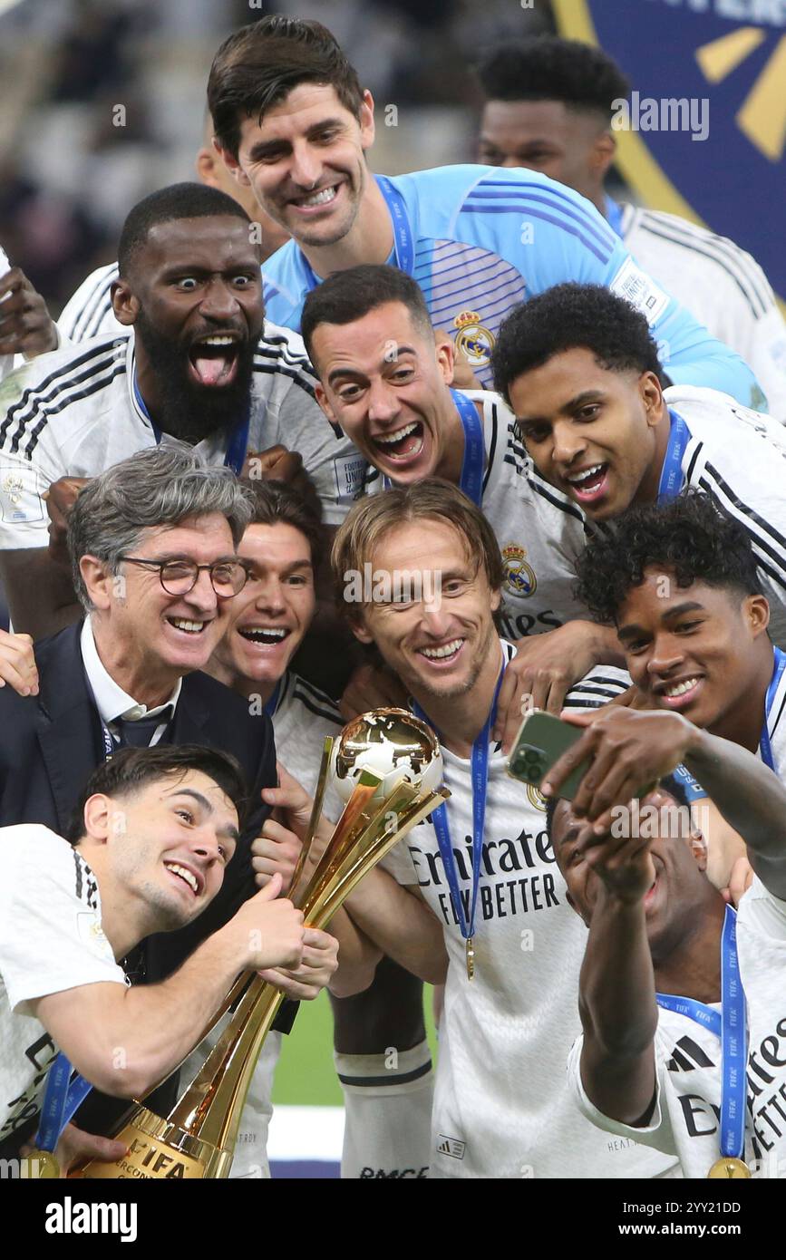 Real Madrid's players celebrate with the trophy after winning the ...