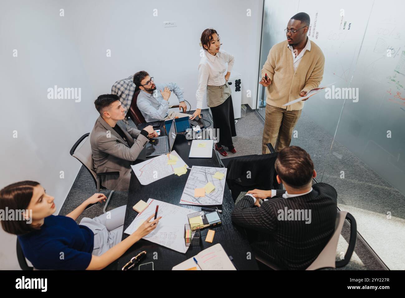 Multicultural team brainstorming during a business meeting Stock Photo ...