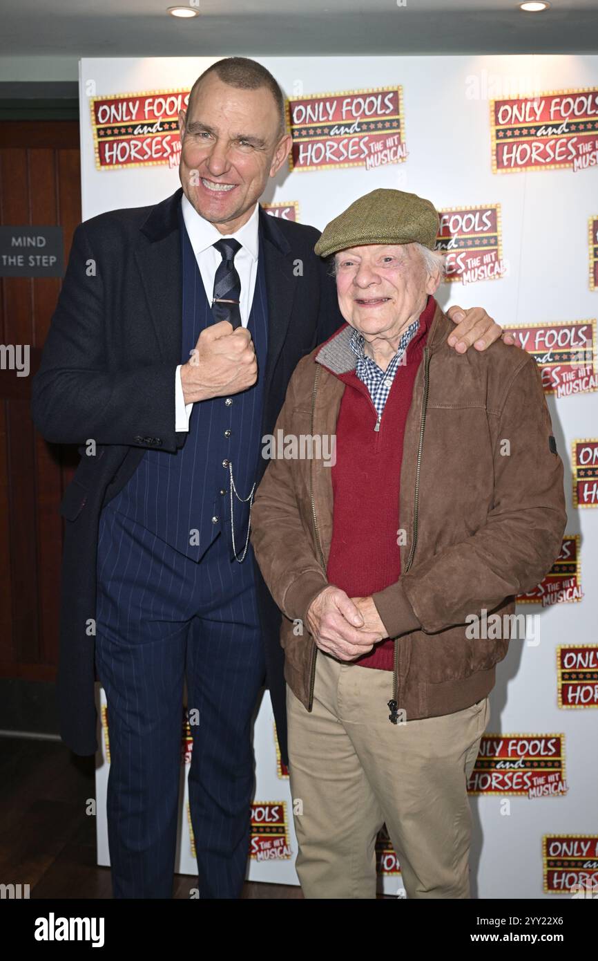 Actor Sir David Jason (left) joins cast member Vinnie Jones of Only Fools and Horses The Musical ahead of the opening night at the Hammersmith Apollo, in west London, which sees the West End debut of actor Vinnie Jones playing gangster Danny Driscoll. Picture date: Wednesday December 18, 2024. Stock Photo