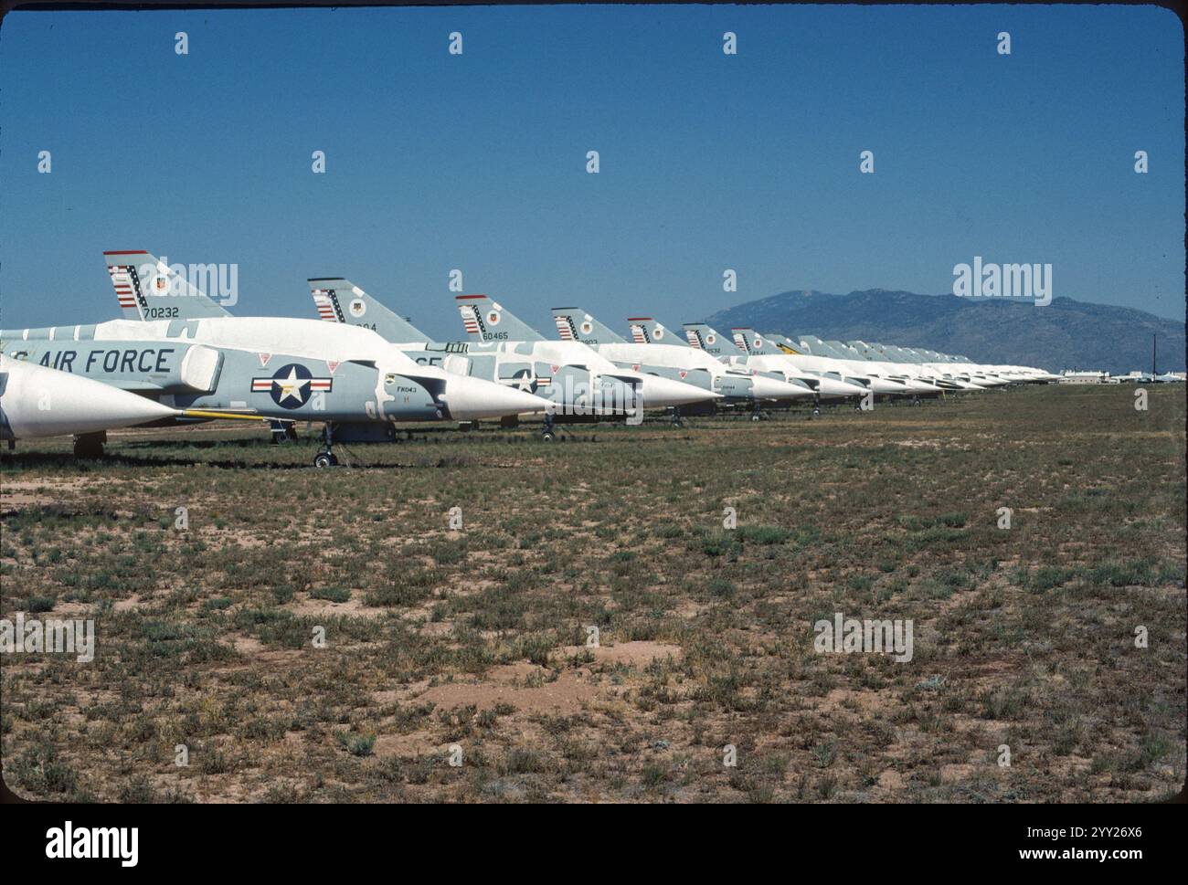 Delta Dart Death Row at AMARC, Davis-Monthan AFB, AZ. Rows of retired Convair F-106 still proudly displaying their unit’s colors. Only about a third of these aircraft escaped the “Pacer Six” drone program. About 199 of the 340 fighters manufactured were converted to QF-106 drones. The QF-106 were Full-Scale Aerial Target (FSAT) for weapons systems evaluation. During their target years from 1990 to 1998 they enabled evaluation of both air-to-air and surface-to-air missile systems. The last shoot down of a QF-106 was by a SAM at Hollomon AFB, NM in February 1997. Stock Photo