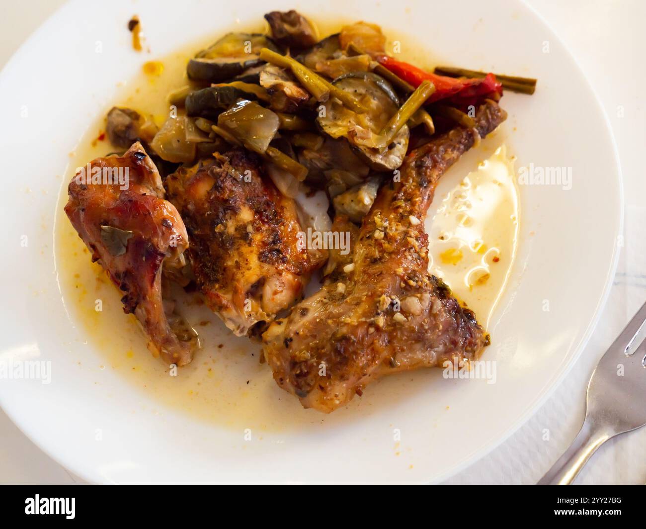 Roasted rabbit served with potato and vegetables Stock Photo
