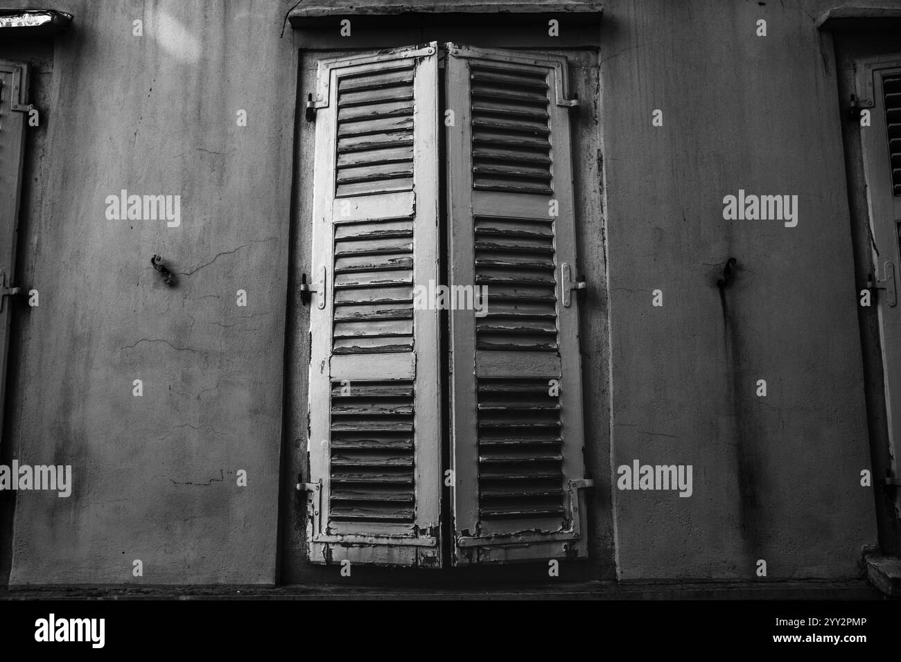 Beautiful photo of an old house window with shutters. Closed shutters ...