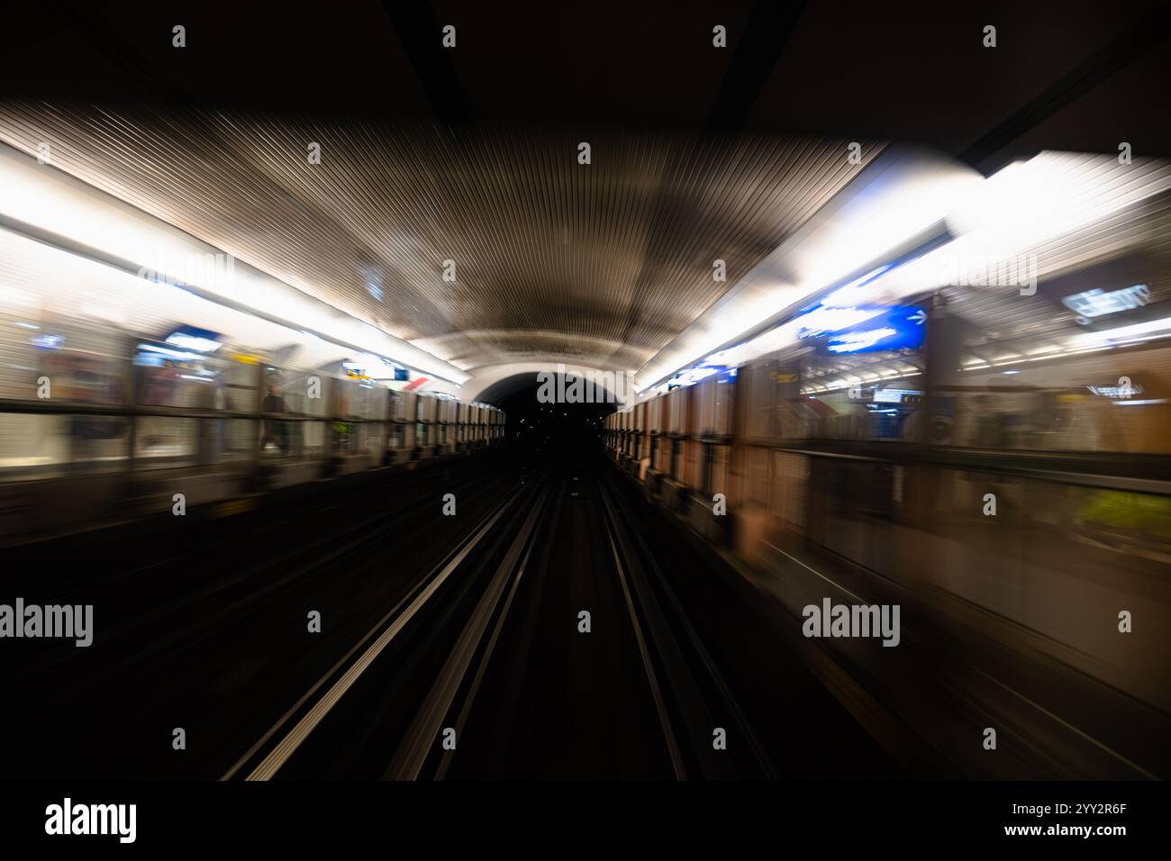 Motion blur of a subway tunnel. Motion-blurred photo from a subway car ...