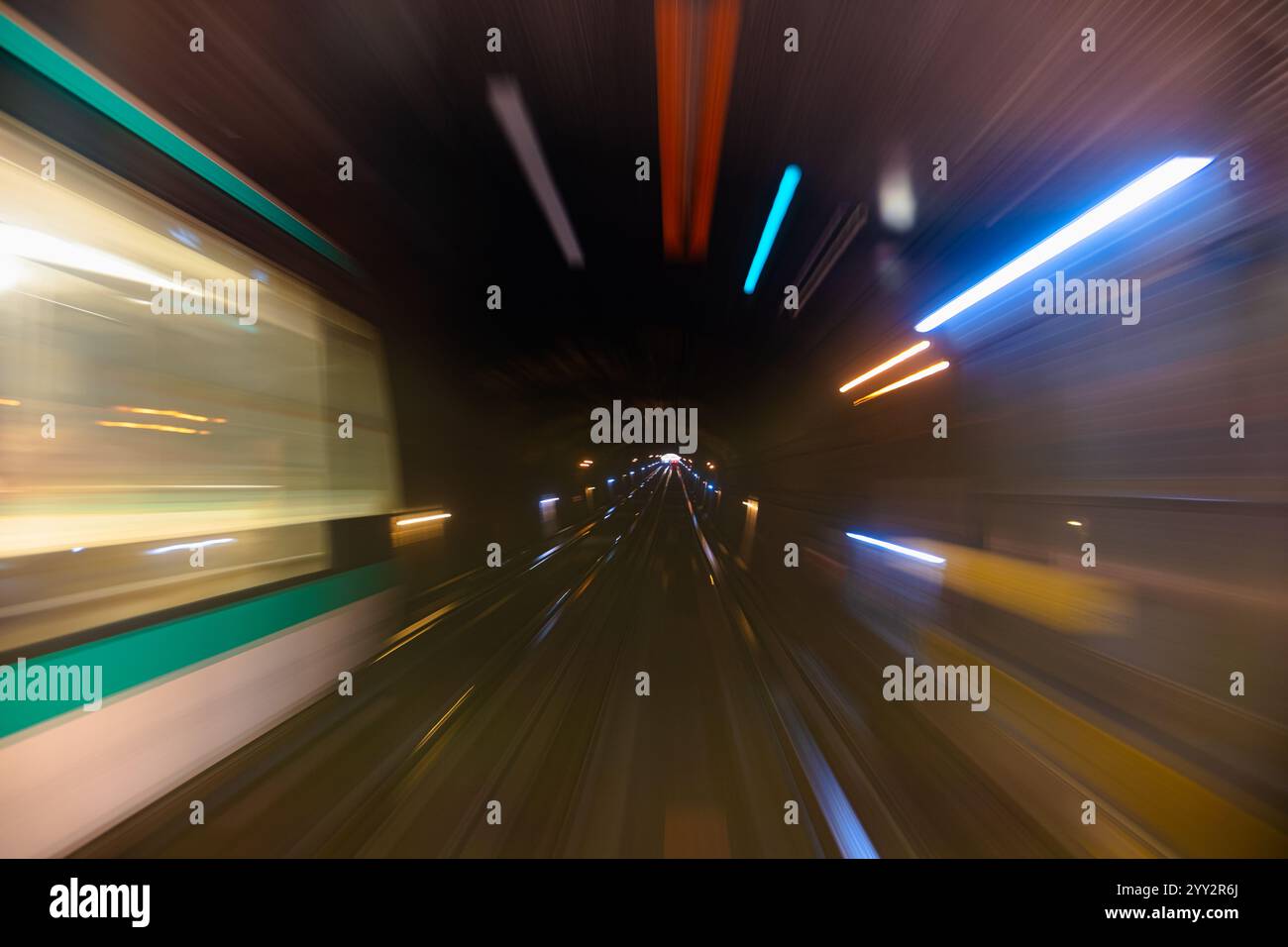 Motion blur of a subway tunnel. Motion-blurred photo from a subway car ...