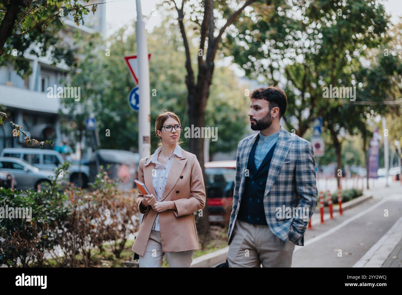 Business people walking and discussing projects in urban setting Stock ...