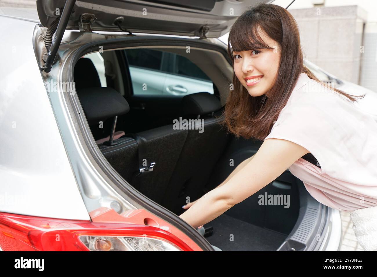Person at car boot hi-res stock photography and images - Alamy