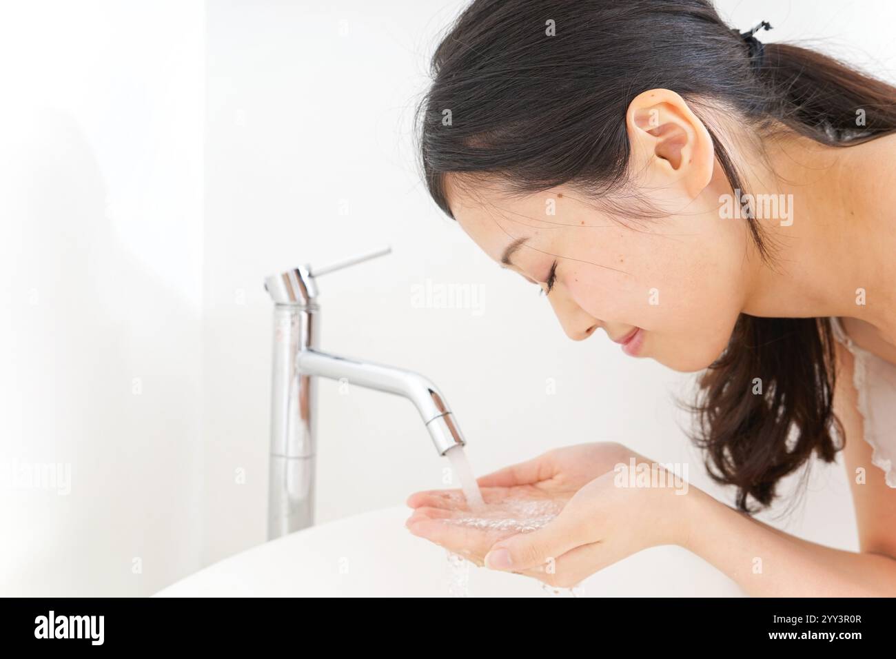 Woman cleansing wash face hi-res stock photography and images - Alamy