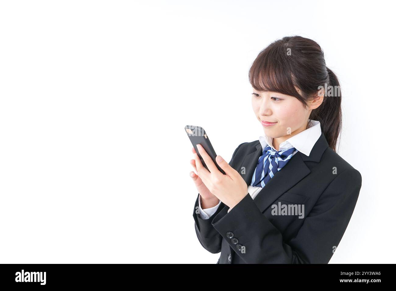 High school girl using a smartphone Stock Photo