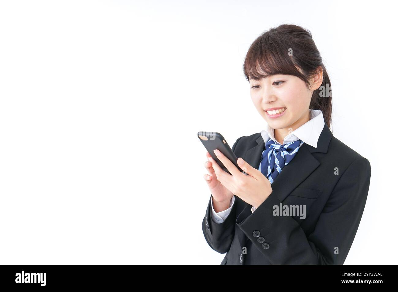High school girl using a smartphone Stock Photo