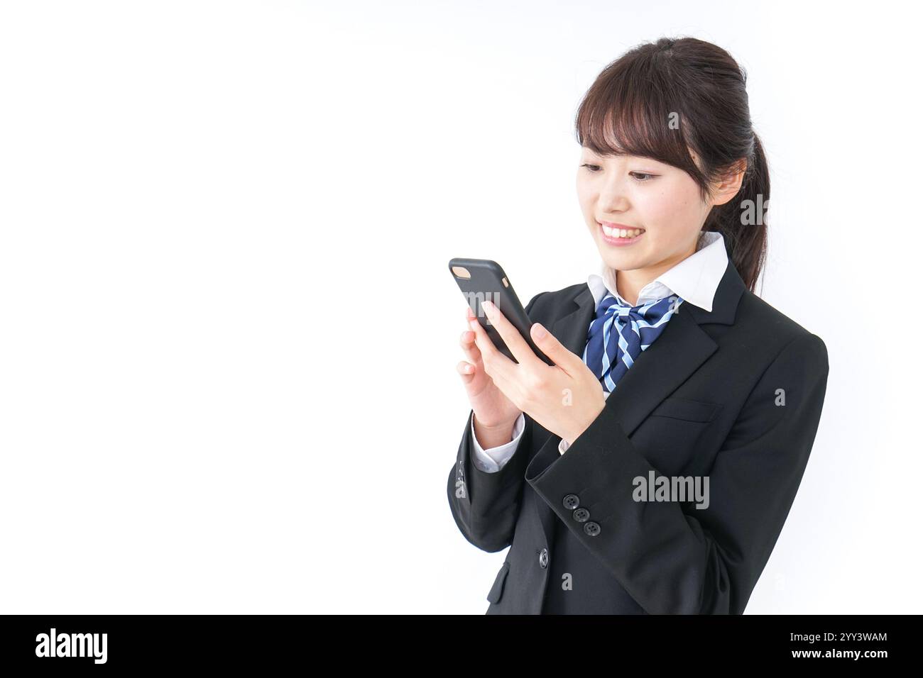 High school girl using a smartphone Stock Photo