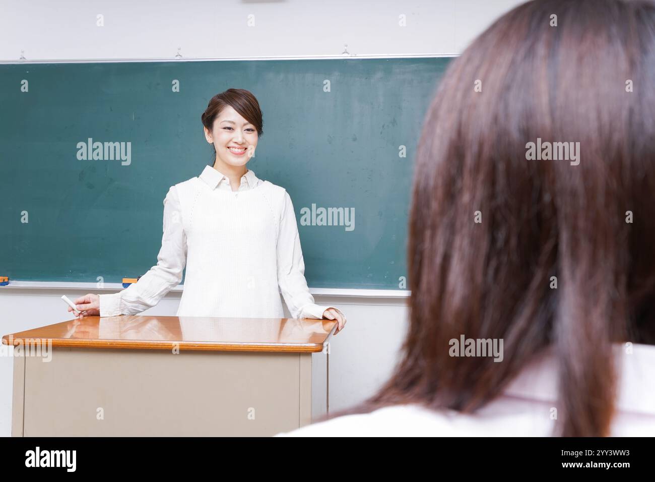 Lesson For Teched Teacher giving a lesson at school Stock Photo - Alamy