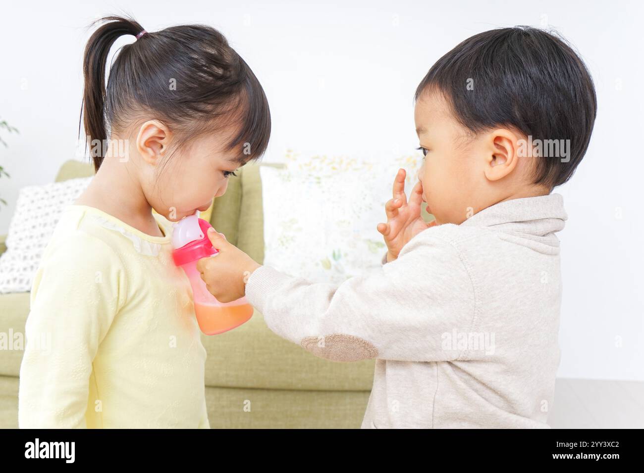 Two girls and a boy playing Stock Photo - Alamy