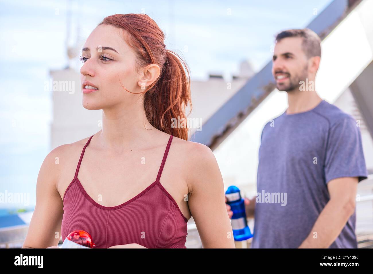Fit Couple Taking a Break During Outdoor Workout Stock Photo