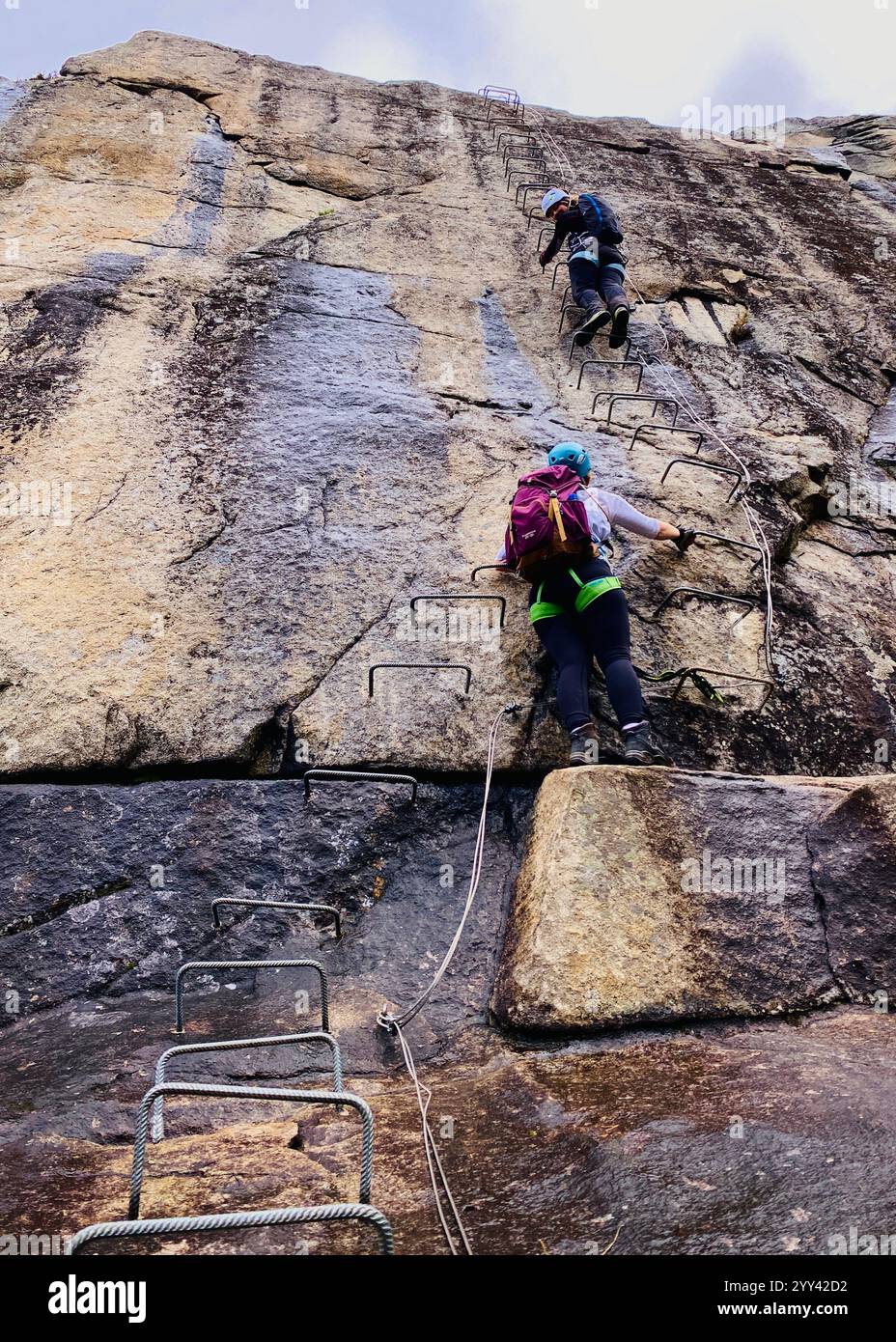 Climbers climbing Trolltunga via-Ferrata in Norway - Smartphone Captured Stock Image