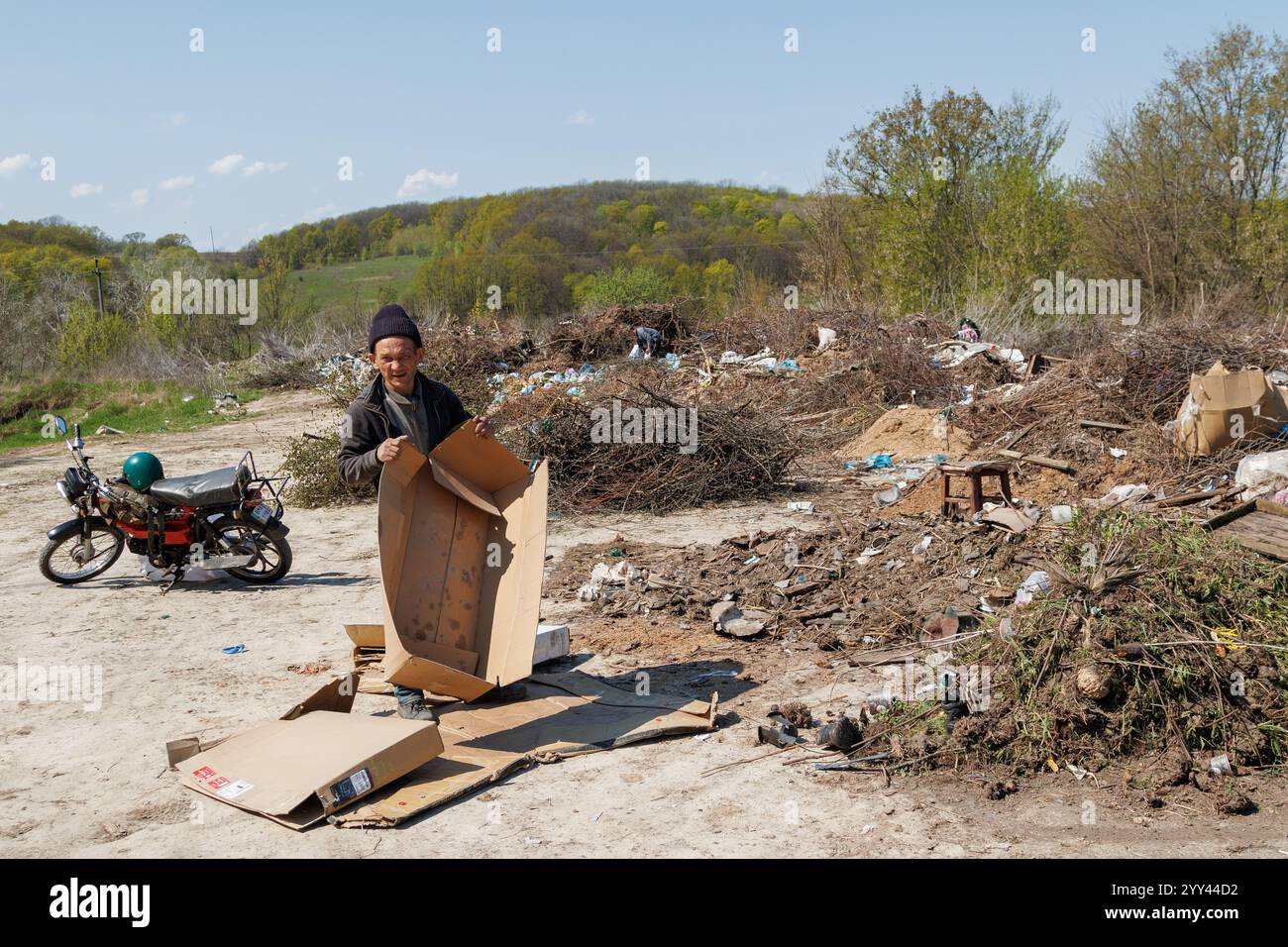 A view of the landfill. Garbage dump. A pile of plastic rubbish, food waste and other rubbish. Pollution concept. A sea of garbage starts to invade an Stock Photo