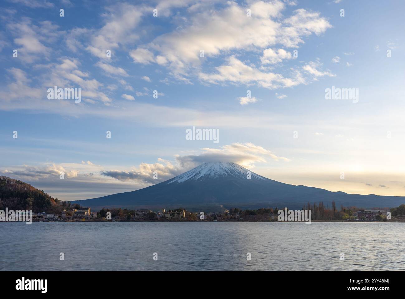 View of Mount Fuji during sunset with moving cloud on top of the mountain Stock Photo