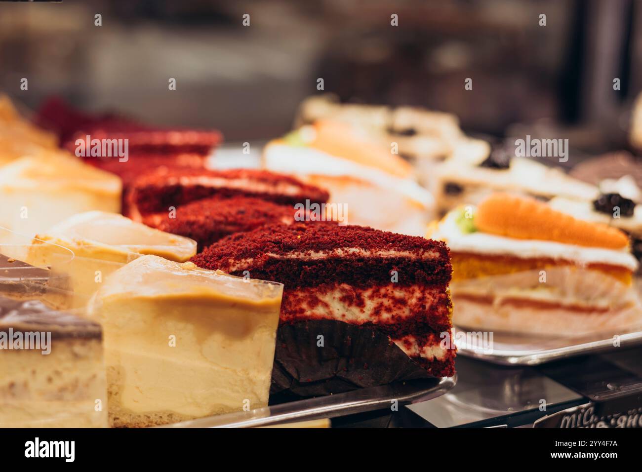 A delightful display of assorted cakes and pastries, including red ...