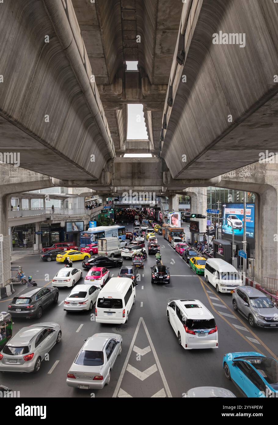 Bangkok, Thailand city traffic jam under layers of the Bangkok Skytrain railway Stock Photo