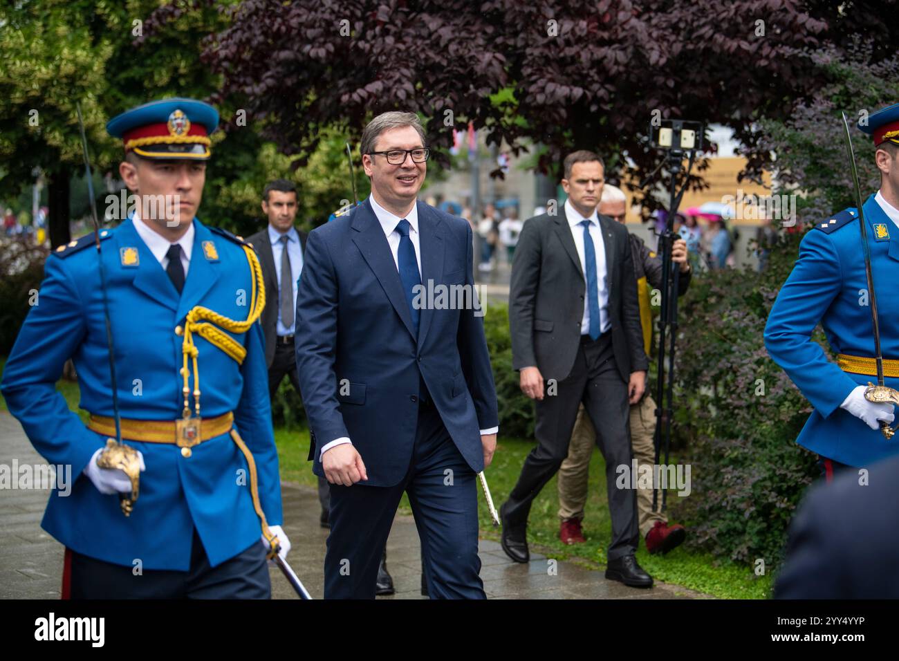 Aleksandar Vucic, the President of Serbia walking on city streets with ...