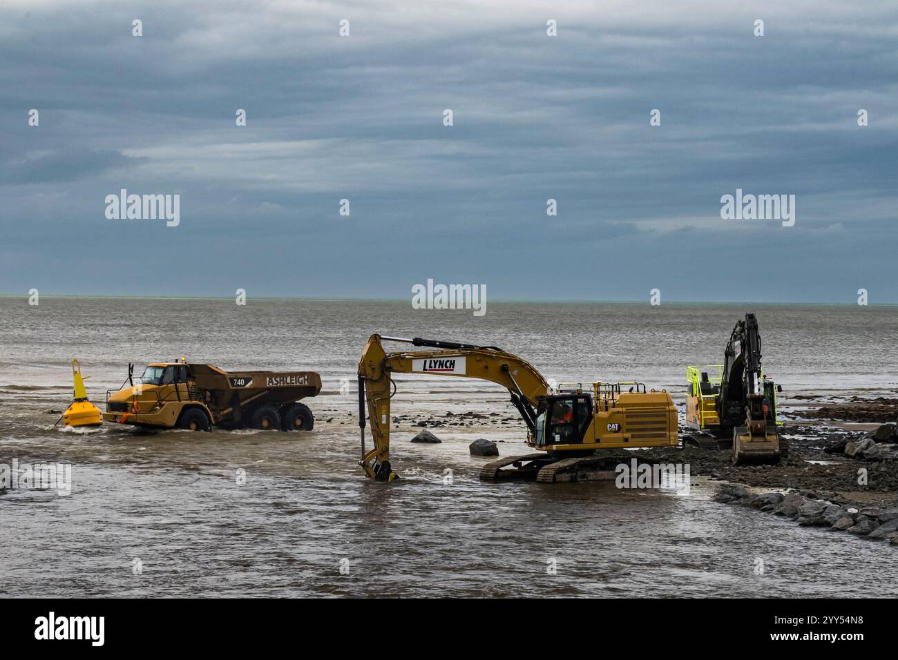 Dump trucks transporting rocks for a water brake hi-res stock ...