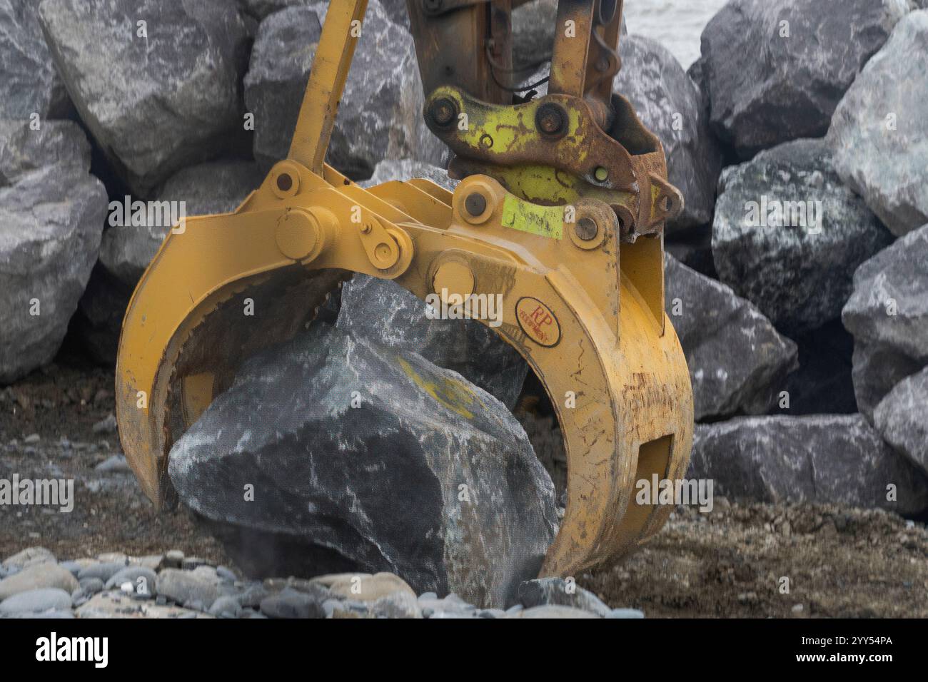 dump trucks transporting rocks for a water brake Stock Photo - Alamy