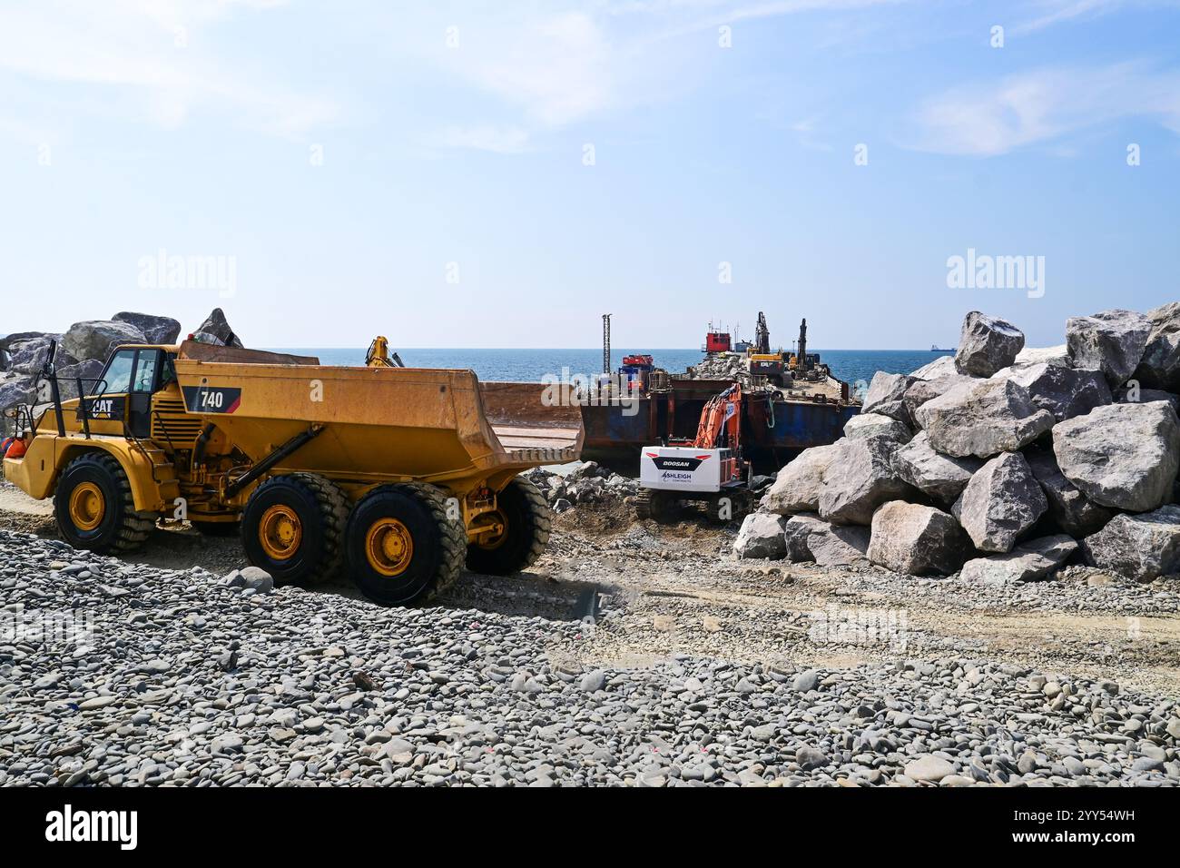 Dump trucks transporting rocks for a water brake hi-res stock ...