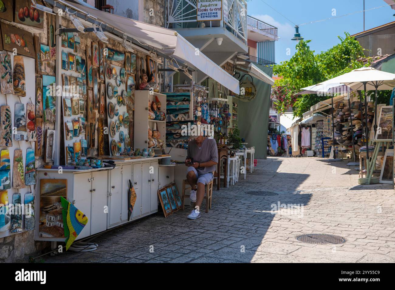 Restaurants and taverns next to sea in historical town. Situated on top of a hill the village of Afitos or Athitos, features stone houses Stock Photo