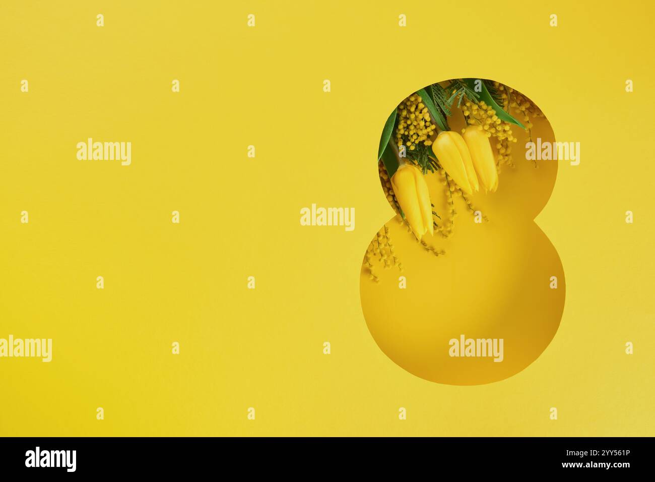 8 March greeting card. Paper cut Eight made of yellow background and fresh spring flowers bouquet of yellow mimosa and tulips. Greeting card for Inter Stock Photo